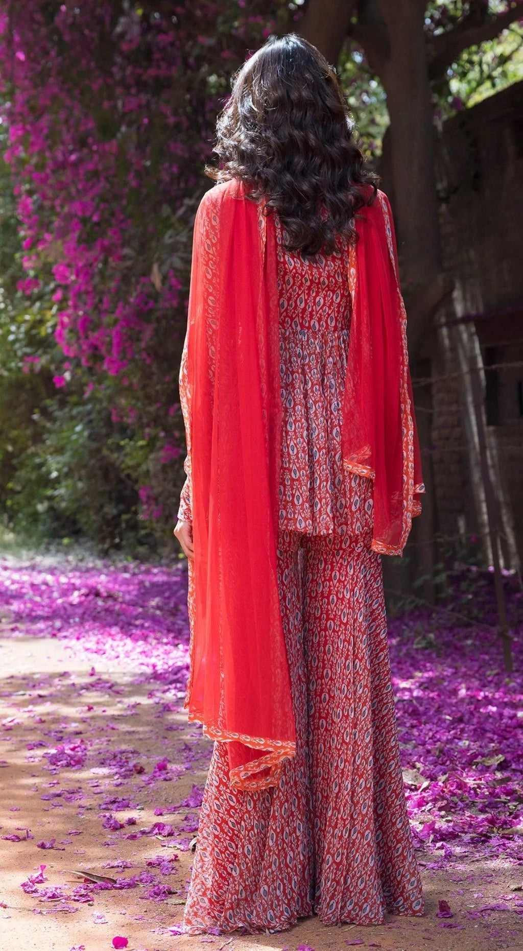 drop printed full sleeves sharara suit set with a peplum top front embellishment red basanti kapde aur koffee